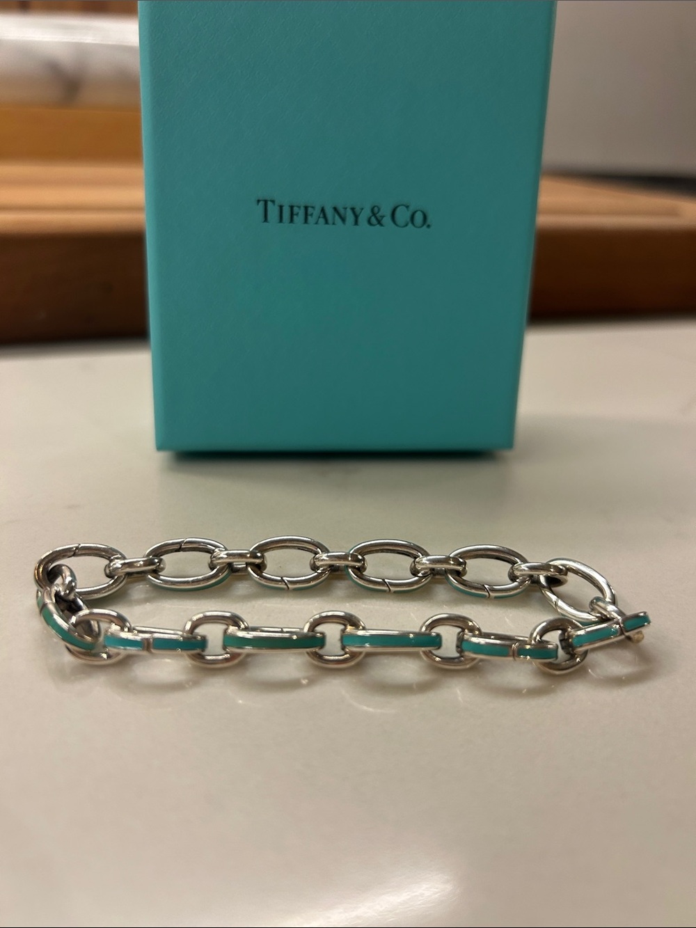 Tiffany & Co. Blue Enamel Clasping Oval
Link Bracelet Silver Charm 7.5"